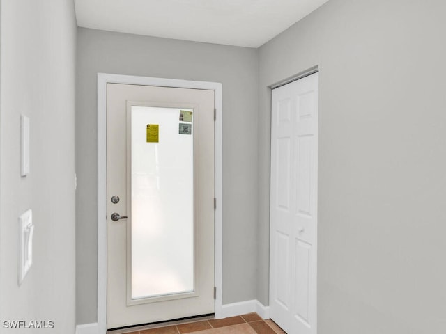 entryway featuring light tile patterned floors