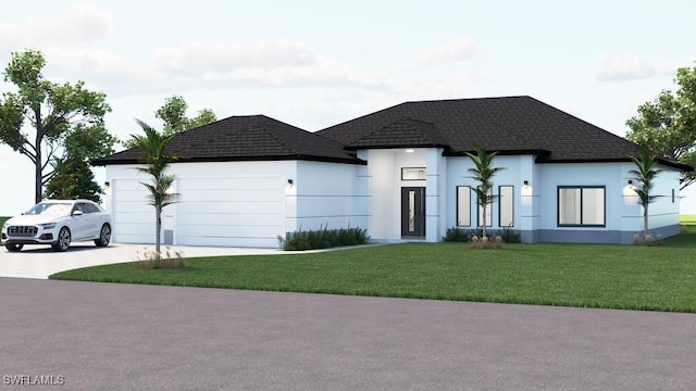 view of front facade with a front yard and a garage