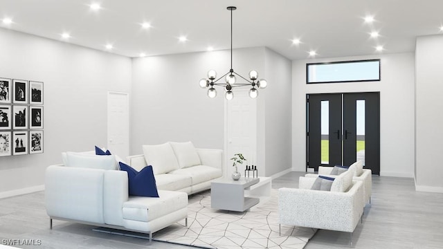 living room featuring light wood-type flooring, a towering ceiling, and an inviting chandelier