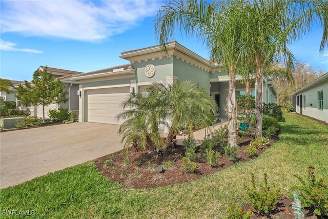 view of front of house featuring a front yard and a garage