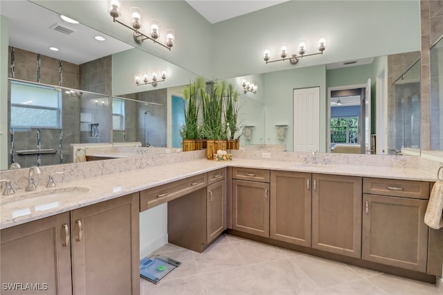 bathroom with vanity, tile patterned floors, and a shower with shower door