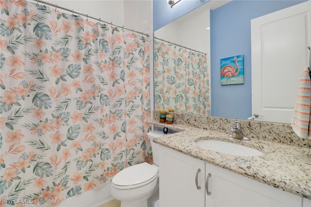 bathroom with a shower with curtain, vanity, and toilet