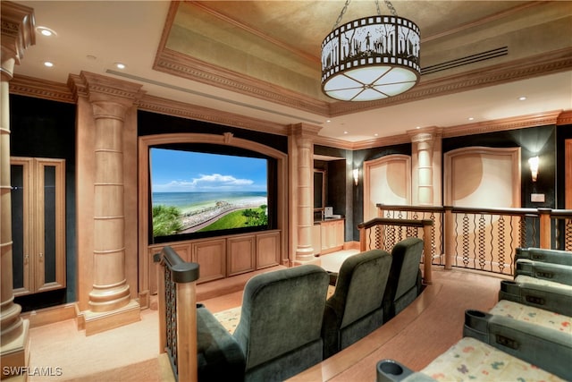 home theater featuring ornate columns and crown molding