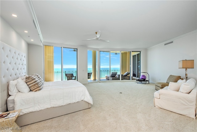 bedroom featuring access to exterior, carpet flooring, ornamental molding, ceiling fan, and a water view