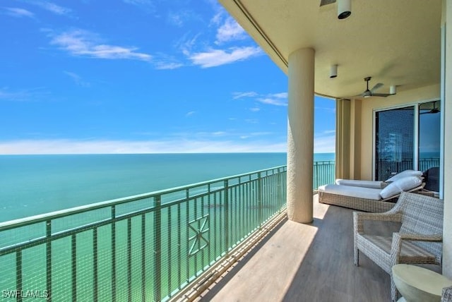 balcony featuring a water view