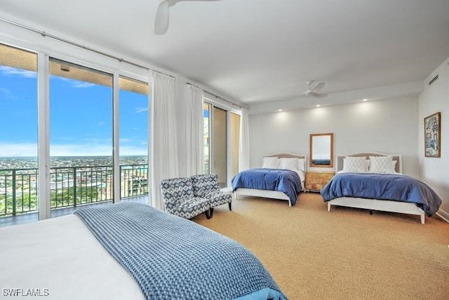 bedroom with access to outside, ceiling fan, and carpet flooring