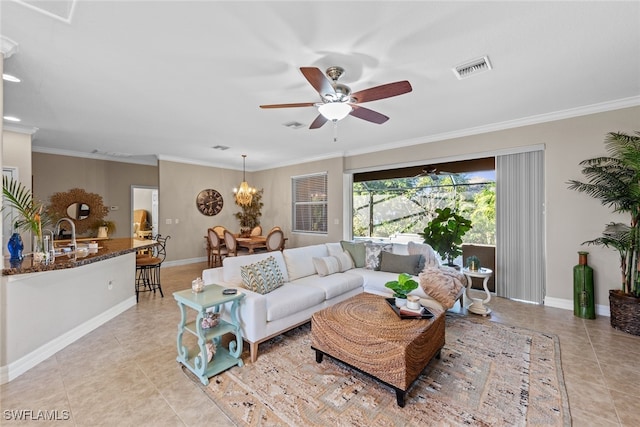 living room featuring ceiling fan with notable chandelier, ornamental molding, sink, and light tile patterned floors