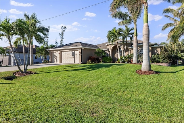 view of front of home featuring a garage and a front lawn