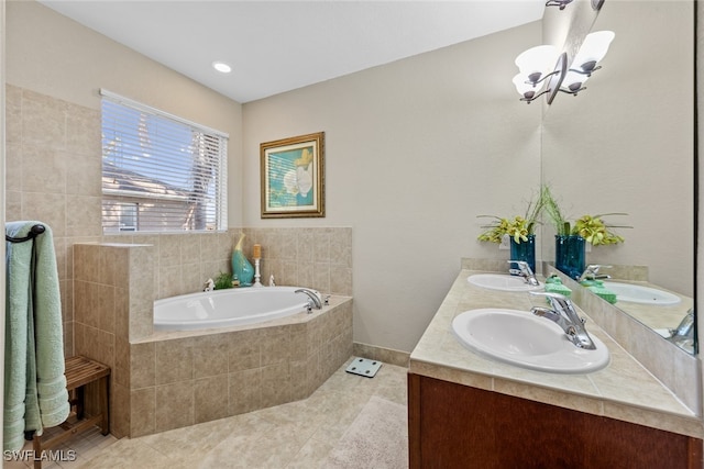 bathroom featuring vanity, tile patterned flooring, and a relaxing tiled tub