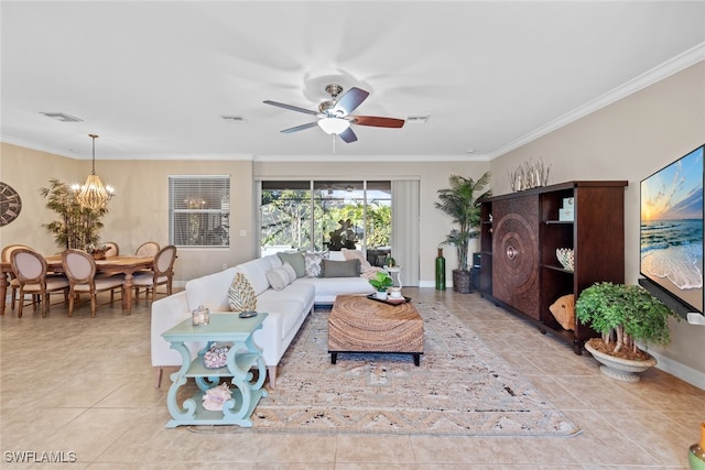 living room with light tile patterned flooring, ceiling fan with notable chandelier, and ornamental molding