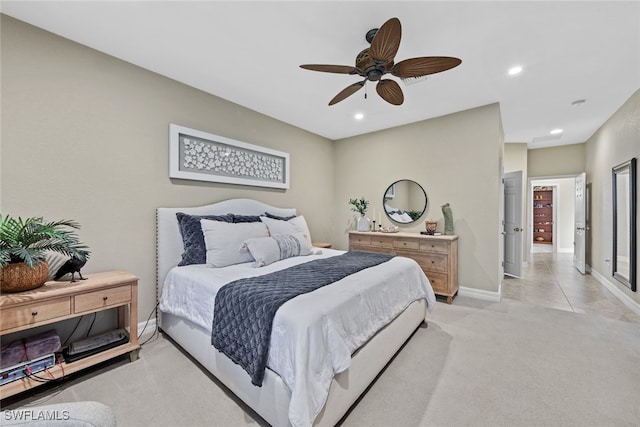 bedroom with light carpet and ceiling fan