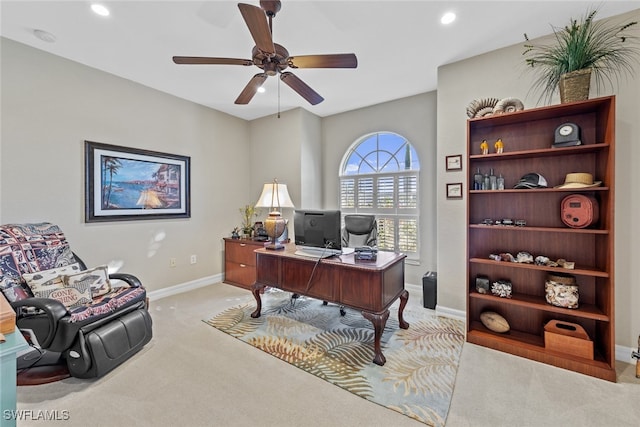 office featuring ceiling fan and light carpet