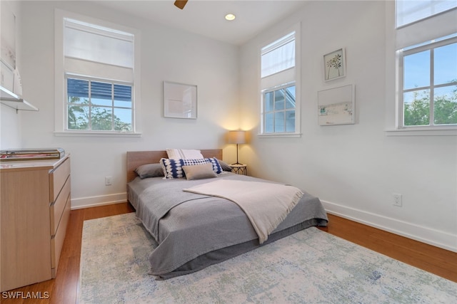 bedroom featuring ceiling fan and light hardwood / wood-style floors