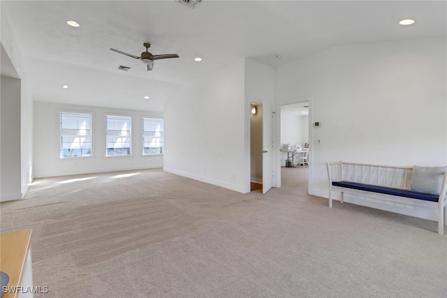 spare room featuring ceiling fan and light colored carpet