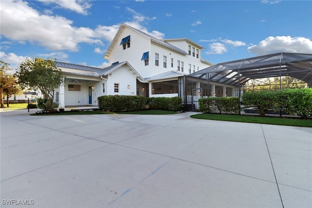 view of front of house with a lanai