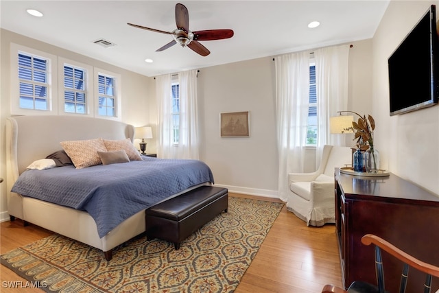 bedroom with light wood-type flooring and ceiling fan