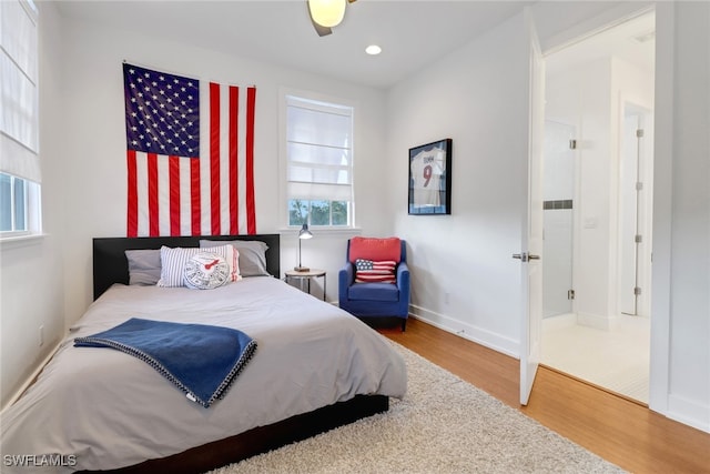 bedroom with hardwood / wood-style floors