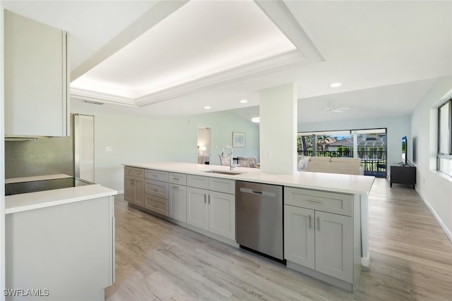 kitchen featuring stainless steel dishwasher, light hardwood / wood-style floors, gray cabinets, and sink