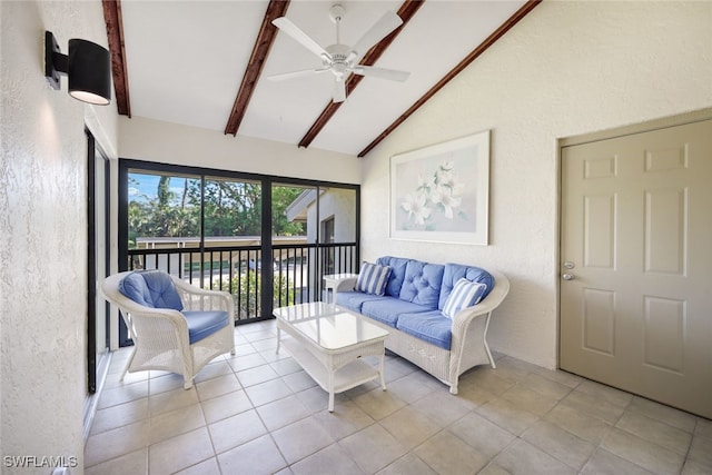 living room featuring ceiling fan, beam ceiling, light tile patterned floors, and high vaulted ceiling