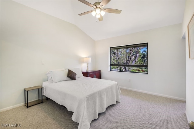 carpeted bedroom featuring ceiling fan and lofted ceiling