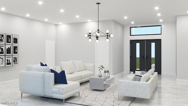 living room with a towering ceiling and a chandelier