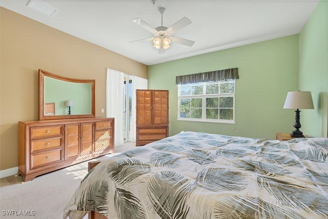 bedroom featuring ceiling fan and light colored carpet