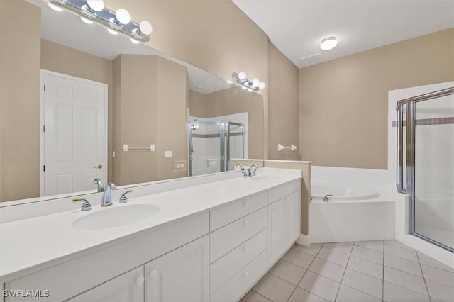 bathroom featuring tile patterned floors, separate shower and tub, and vanity