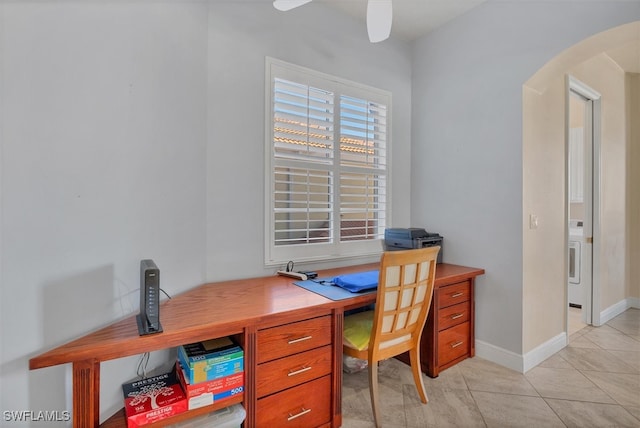 tiled office space featuring ceiling fan