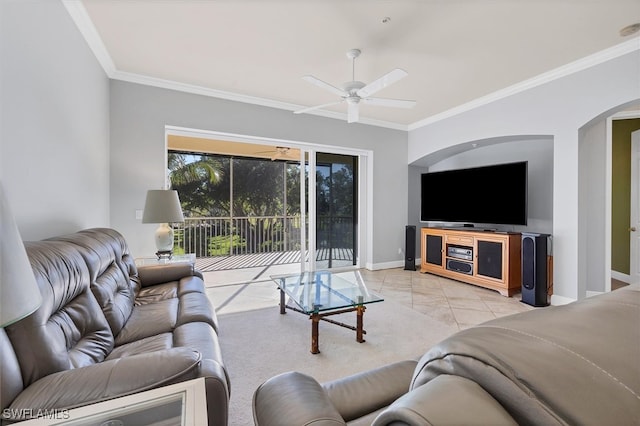 living room with ornamental molding and ceiling fan