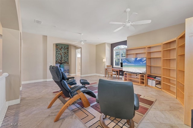 living room featuring ceiling fan