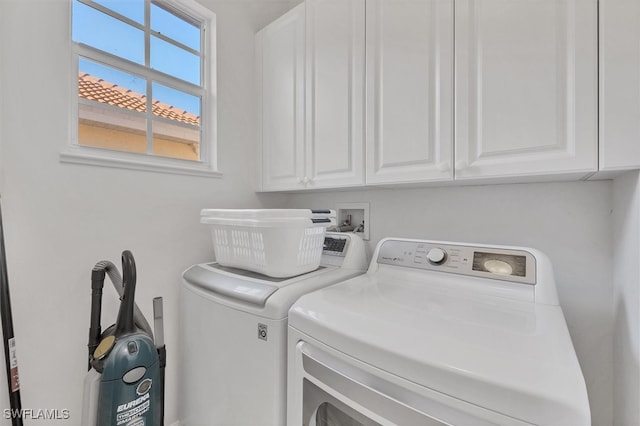 laundry area featuring cabinets and washer and dryer