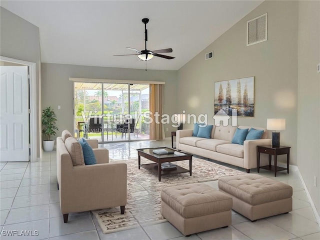 tiled living room featuring ceiling fan and high vaulted ceiling