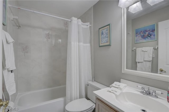 full bathroom with vanity, shower / bath combination with curtain, and toilet