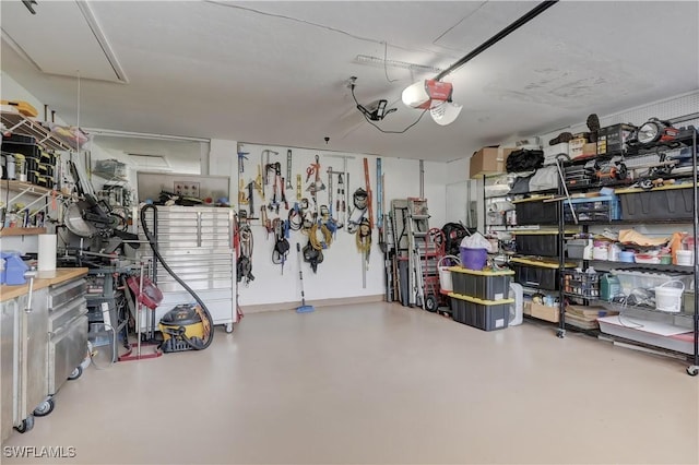 garage featuring a workshop area and a garage door opener