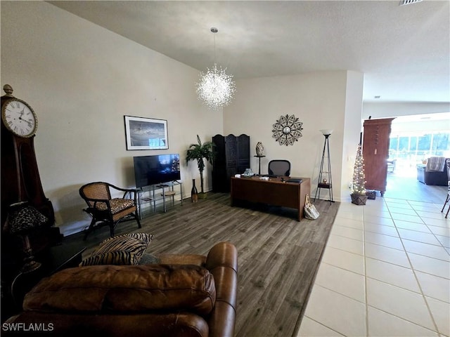 living room featuring hardwood / wood-style floors and a notable chandelier