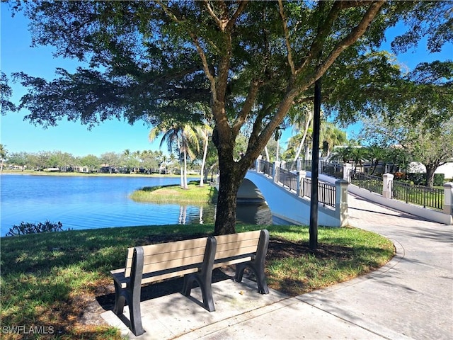 surrounding community featuring a water view