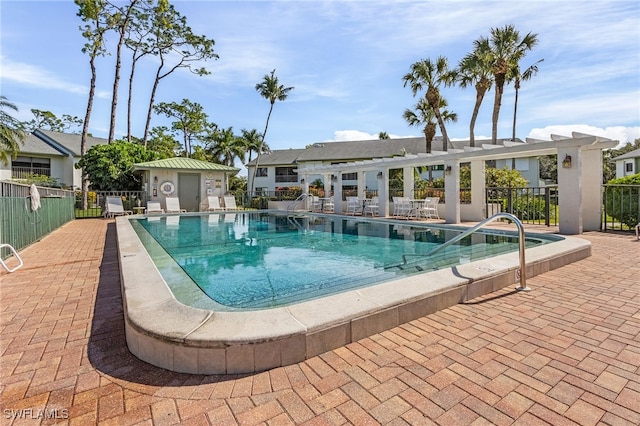 view of swimming pool with a patio