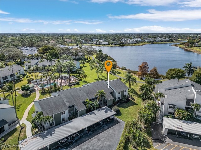 birds eye view of property with a water view