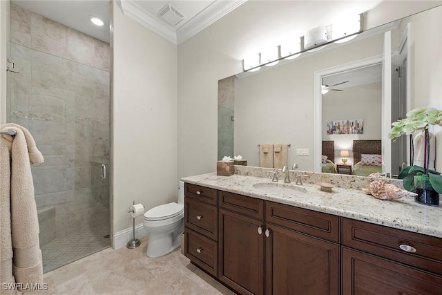 bathroom with tile patterned floors, toilet, crown molding, vanity, and a shower with door