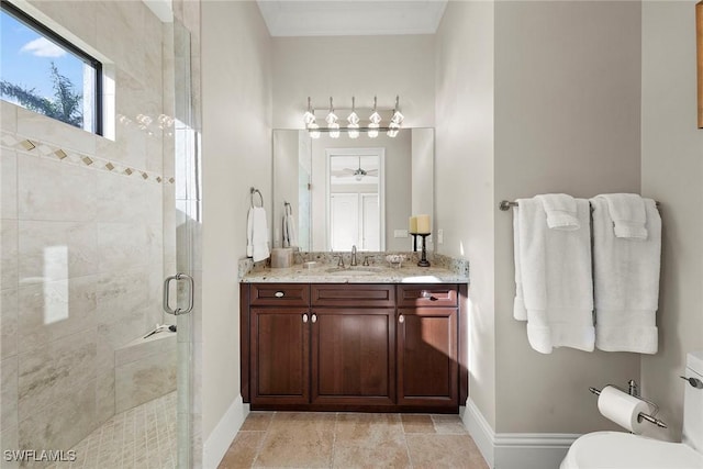 bathroom featuring vanity and a shower with door