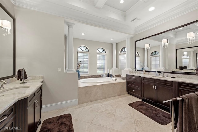 bathroom with crown molding and ornate columns