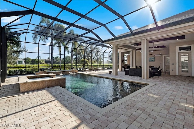 view of pool featuring an outdoor hangout area, a patio, ceiling fan, and glass enclosure