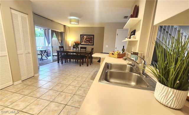 kitchen with sink and light tile patterned floors