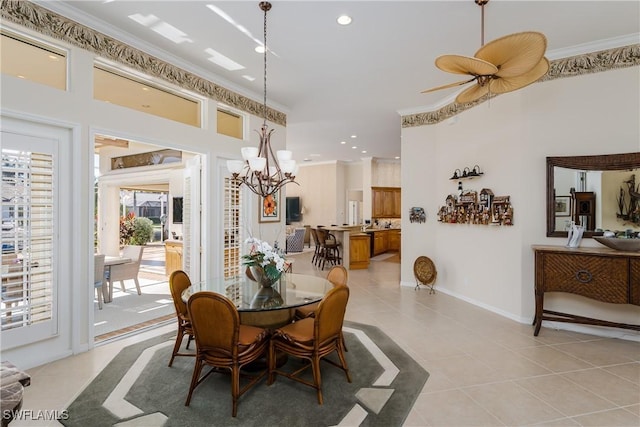 tiled dining space featuring ceiling fan with notable chandelier and crown molding