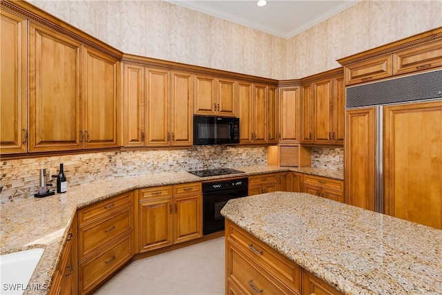 kitchen with black appliances, light stone countertops, light tile patterned floors, and tasteful backsplash