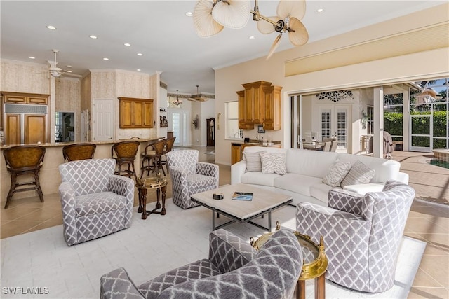 living room featuring french doors, ceiling fan with notable chandelier, and light tile patterned floors