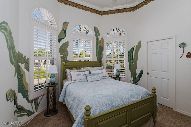 carpeted bedroom featuring crown molding