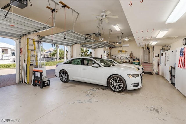 garage featuring ceiling fan and a garage door opener