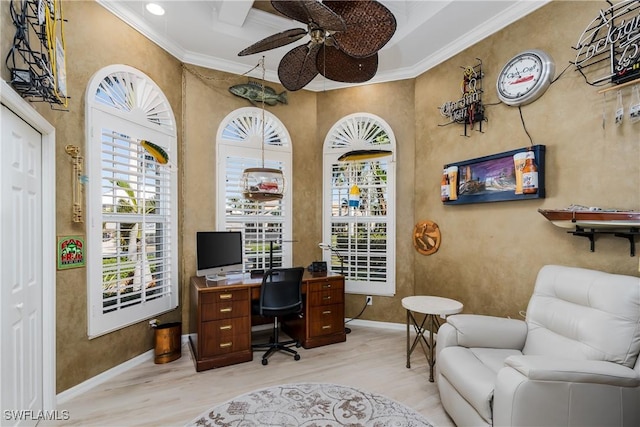 office area with ceiling fan, ornamental molding, and light wood-type flooring