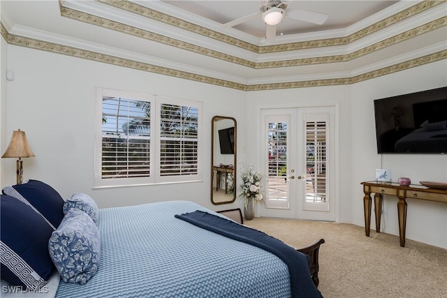 carpeted bedroom with ceiling fan, access to exterior, crown molding, and french doors